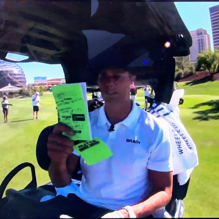 Tom Brady with a StrackaBook during The Match