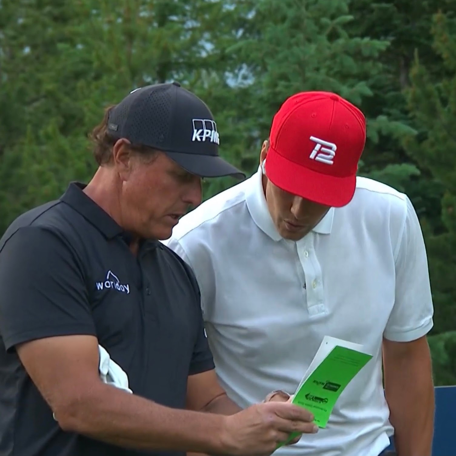 Phil Mickelson and Tom Brady with a StrackaBook during “The Match” – July 2021