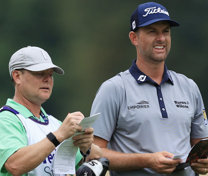 Webb Simpson and caddie Joey Duplantis at the 2020 WGC-FedEx St. Jude Invitational with a StrackaBook