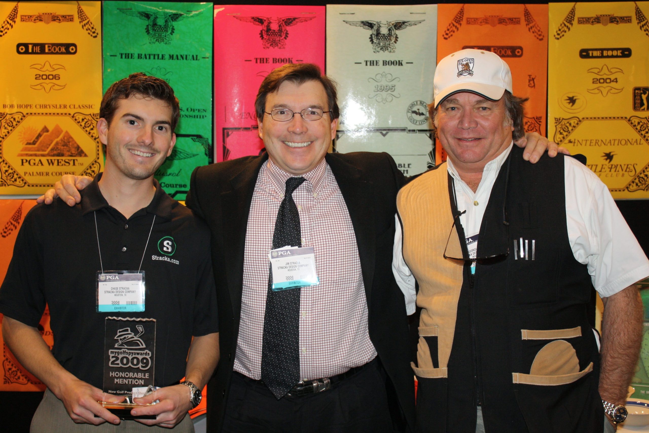 Chase Stracka, Jim Stracka, & “Gorjus” George Lucas at the PGA Show in Orlando, FL, January 2009, post Stracka acquisition of “THE BOOK” yardage books from George Lucas